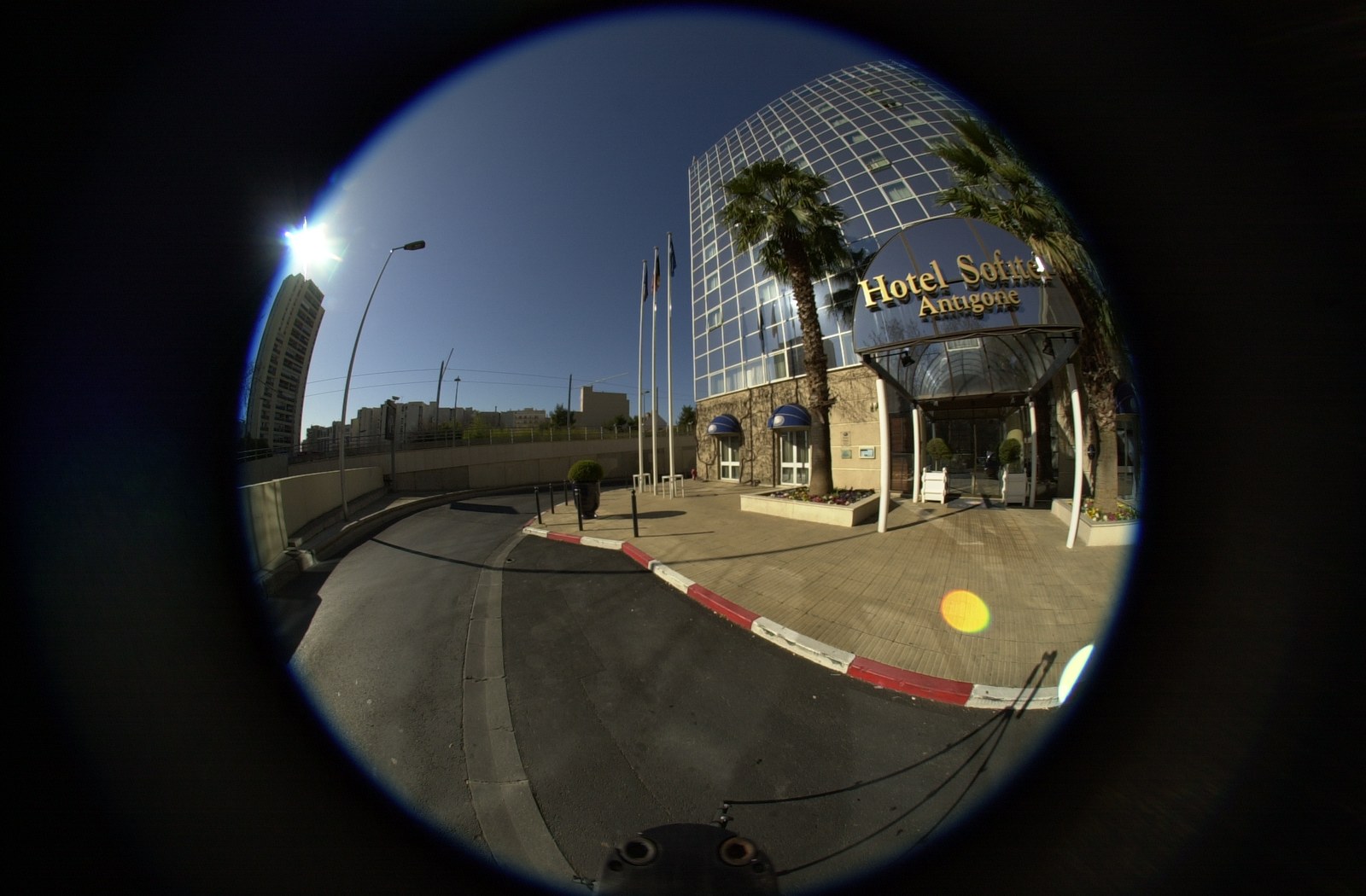 Raw fisheye frame from a Sofitel shoot in Montpellier, March 2003: the entrance.