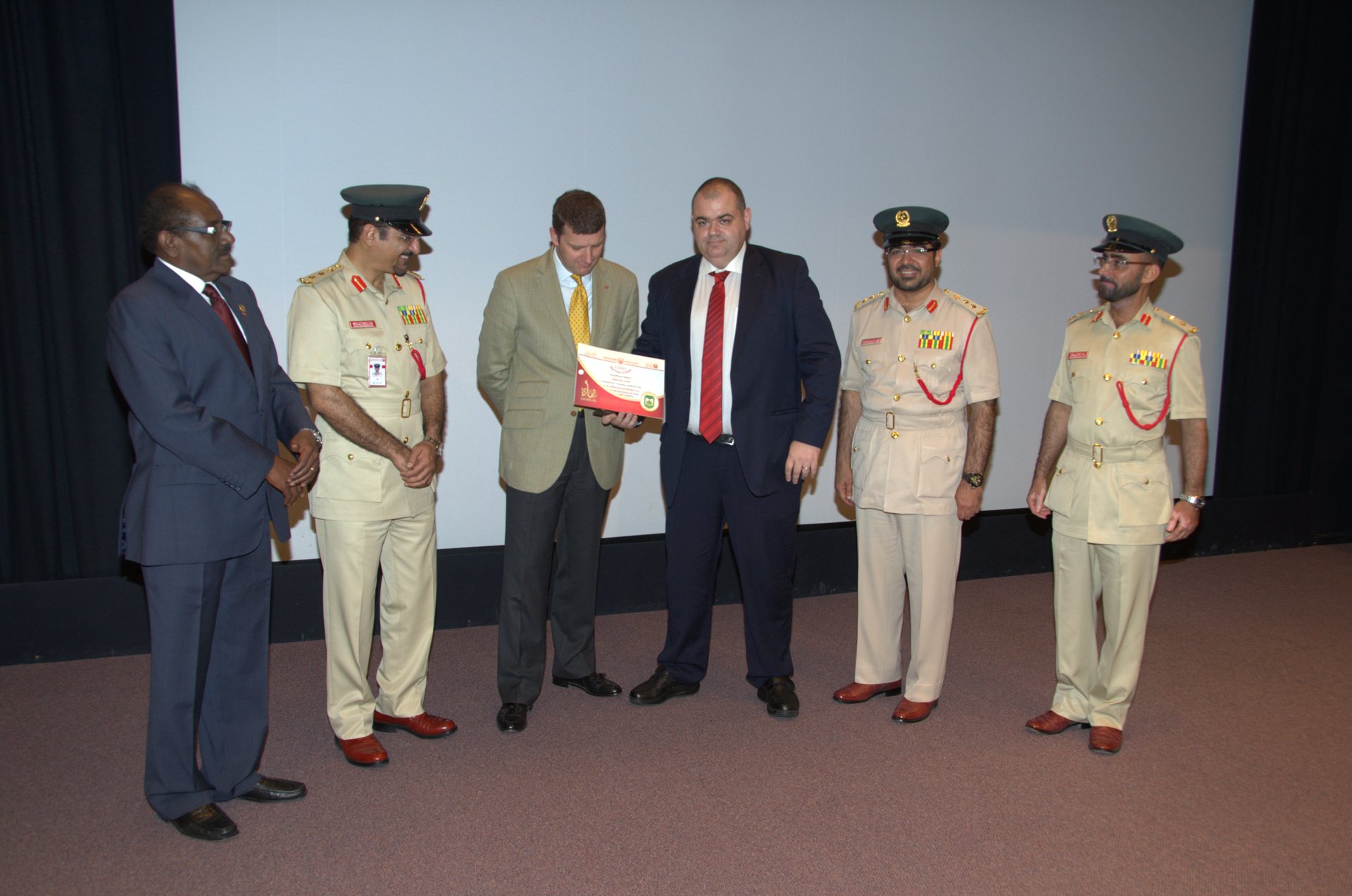 Receiving the recognition at the Dubai Police Academy, 2012.
