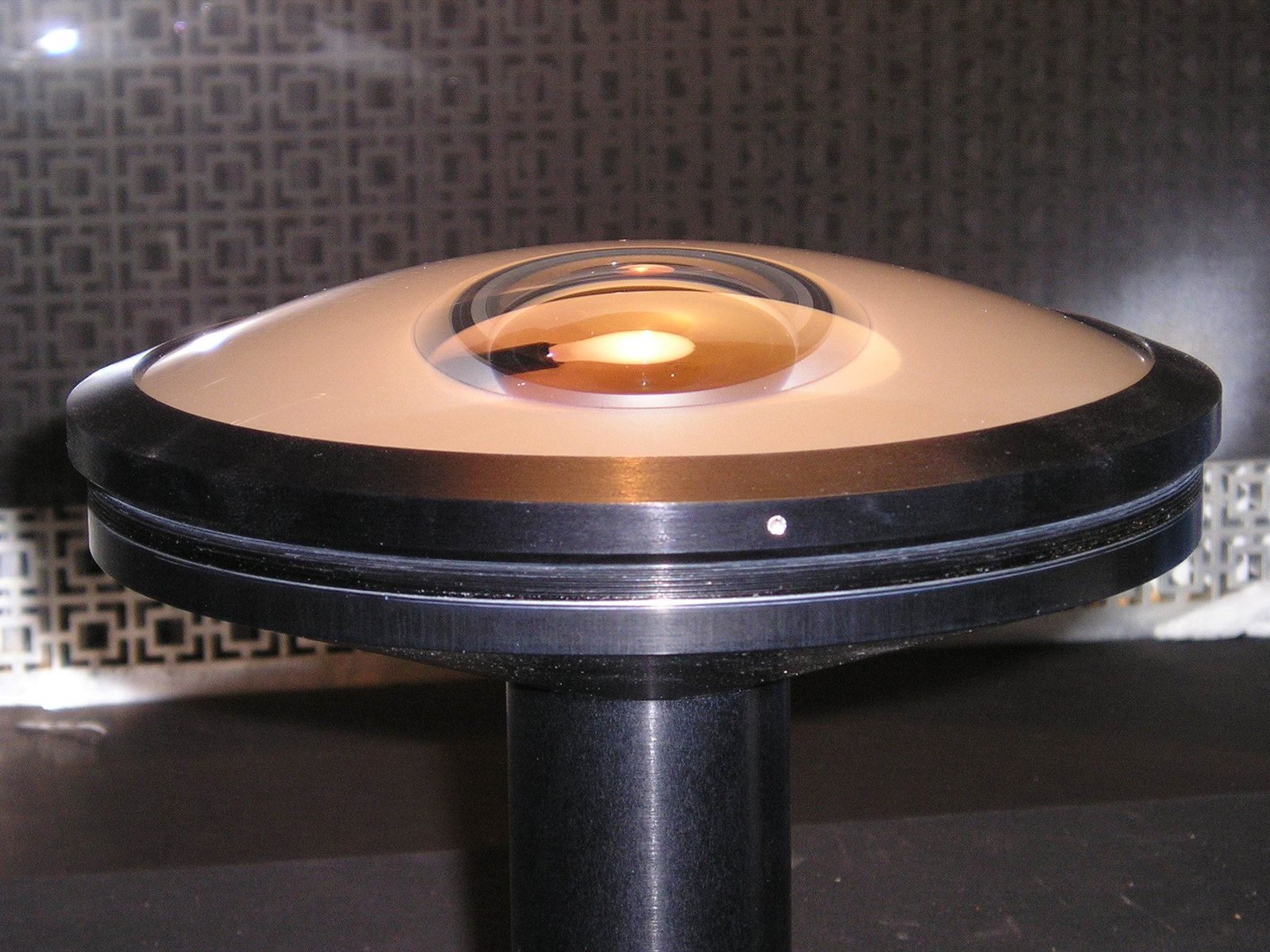 One of the two 220° fisheye elements.